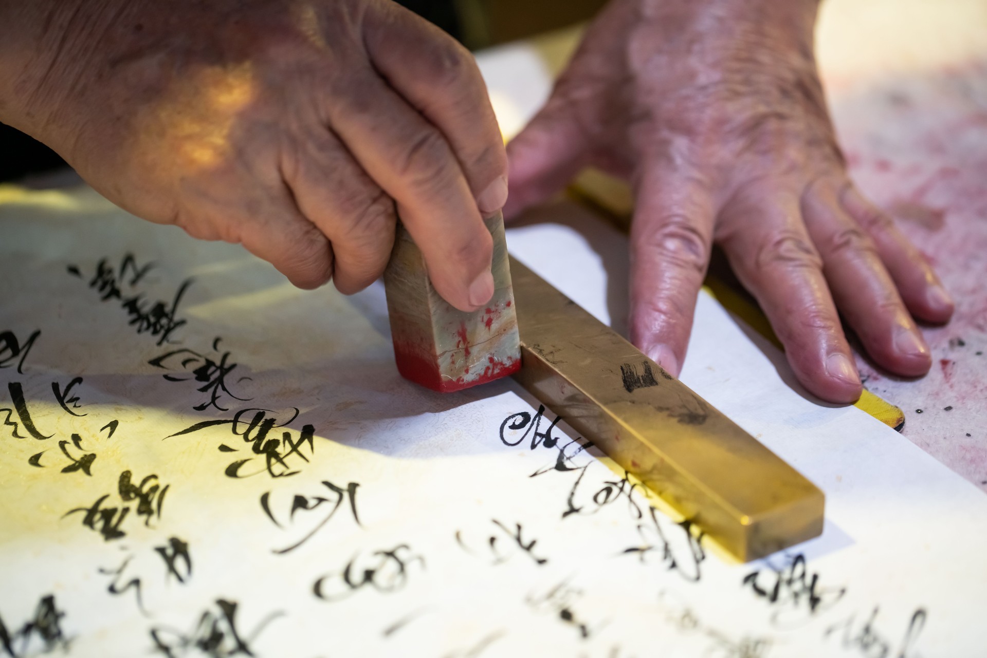 Chinese old man writing Chinese calligraphy